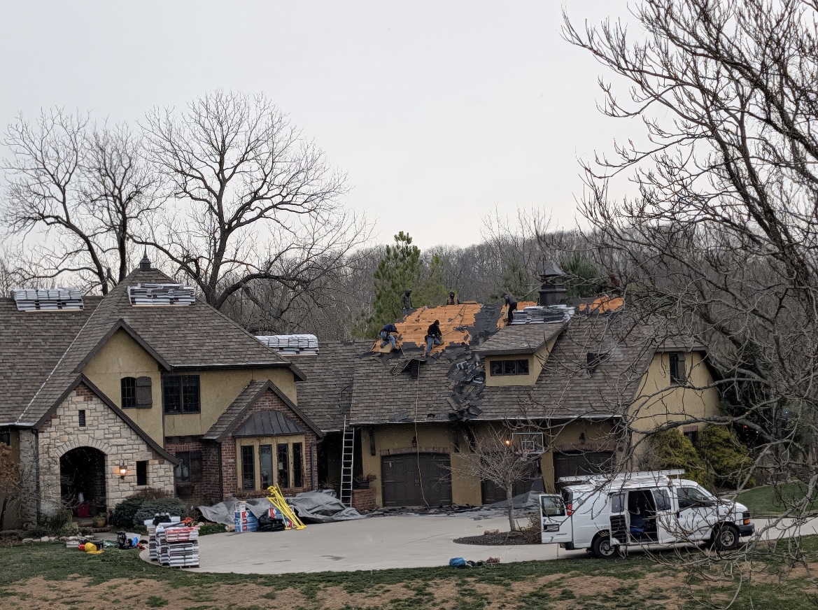 Roof replacement in progress on large Springfield MO home