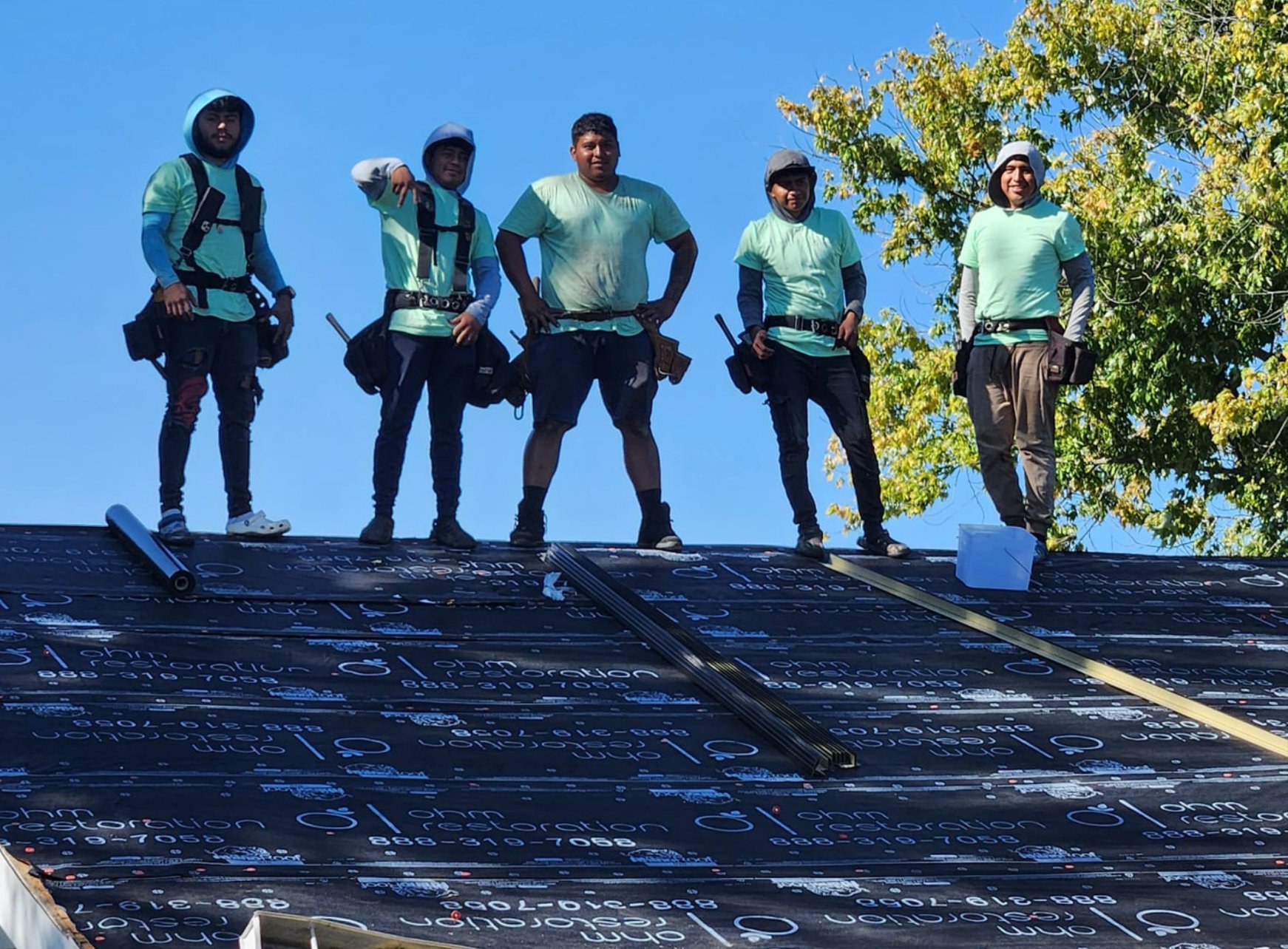 Ohm Restoration roofing crew on a Springfield job site